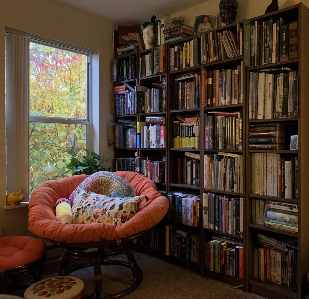 Cozy bedroom with book stack display
