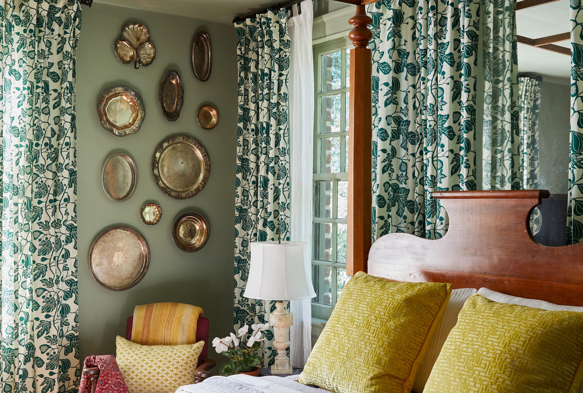 Bedroom wall with plate collection
