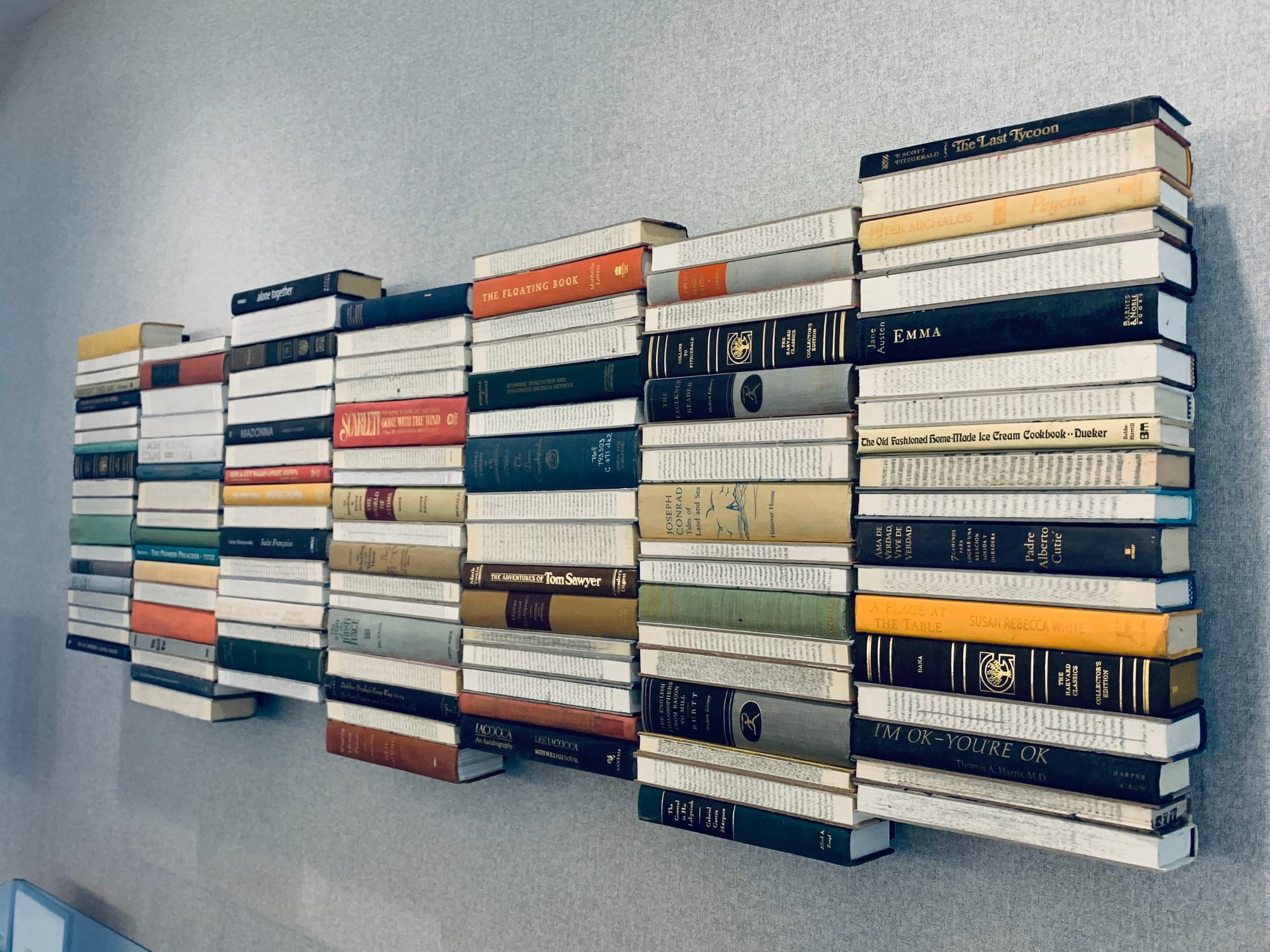 Bedroom wall with book spine gallery