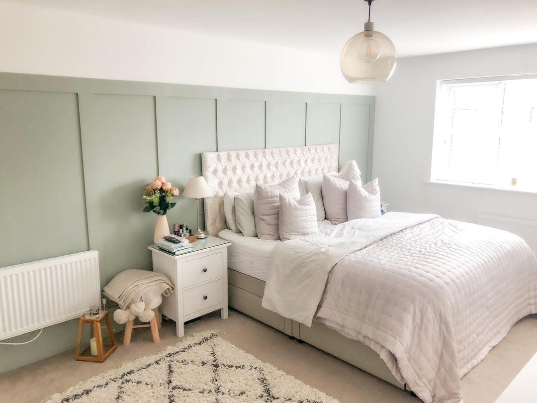 Use soft sage and paneling in your master bedroom