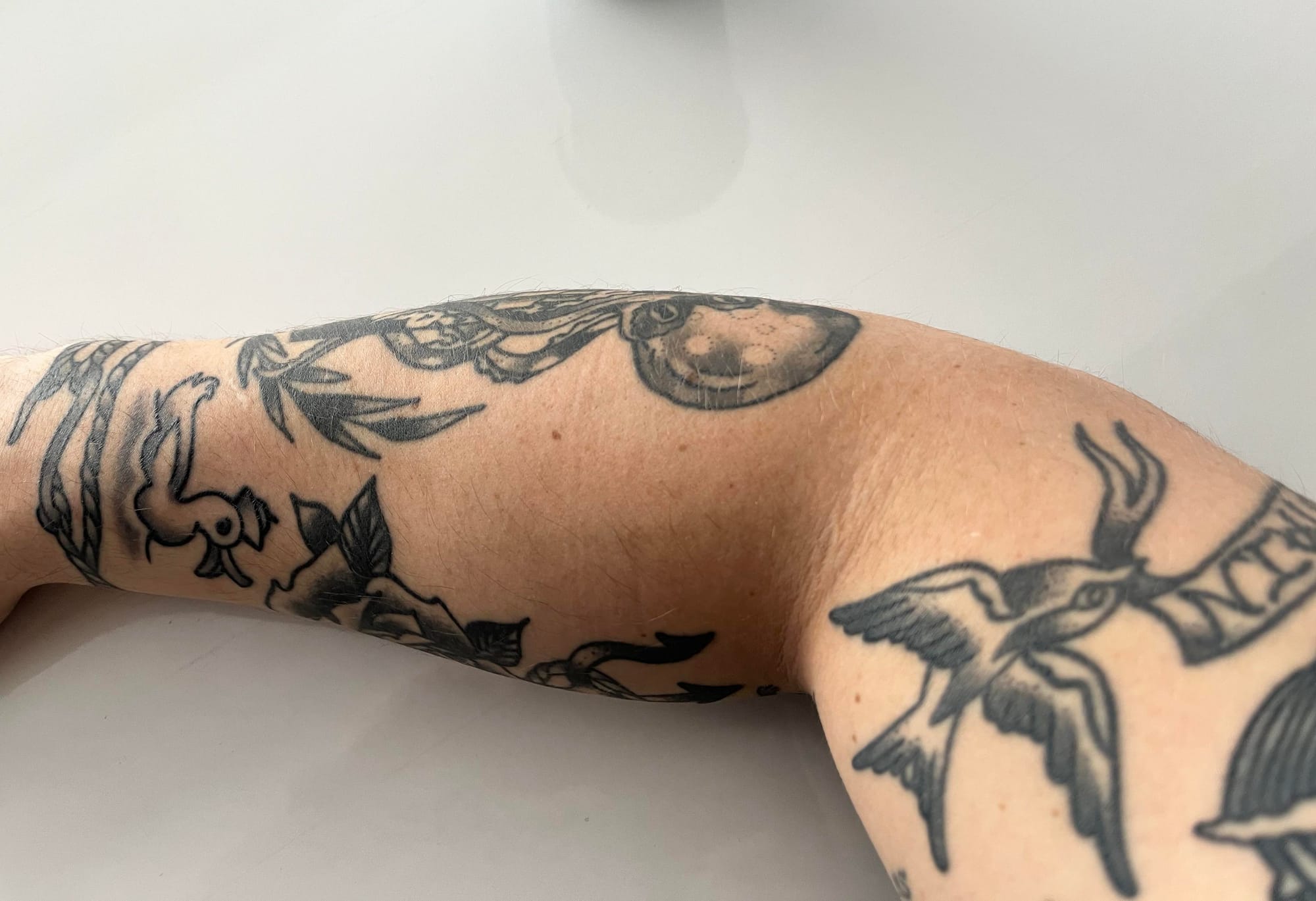 nautical patchwork sleeve tattoo