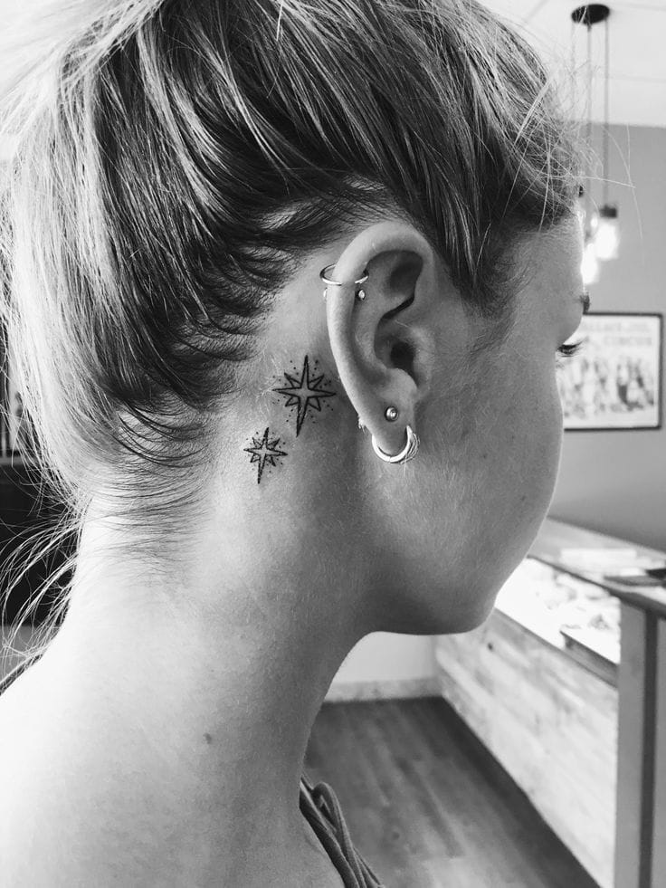 behind-the-ear star tattoo
