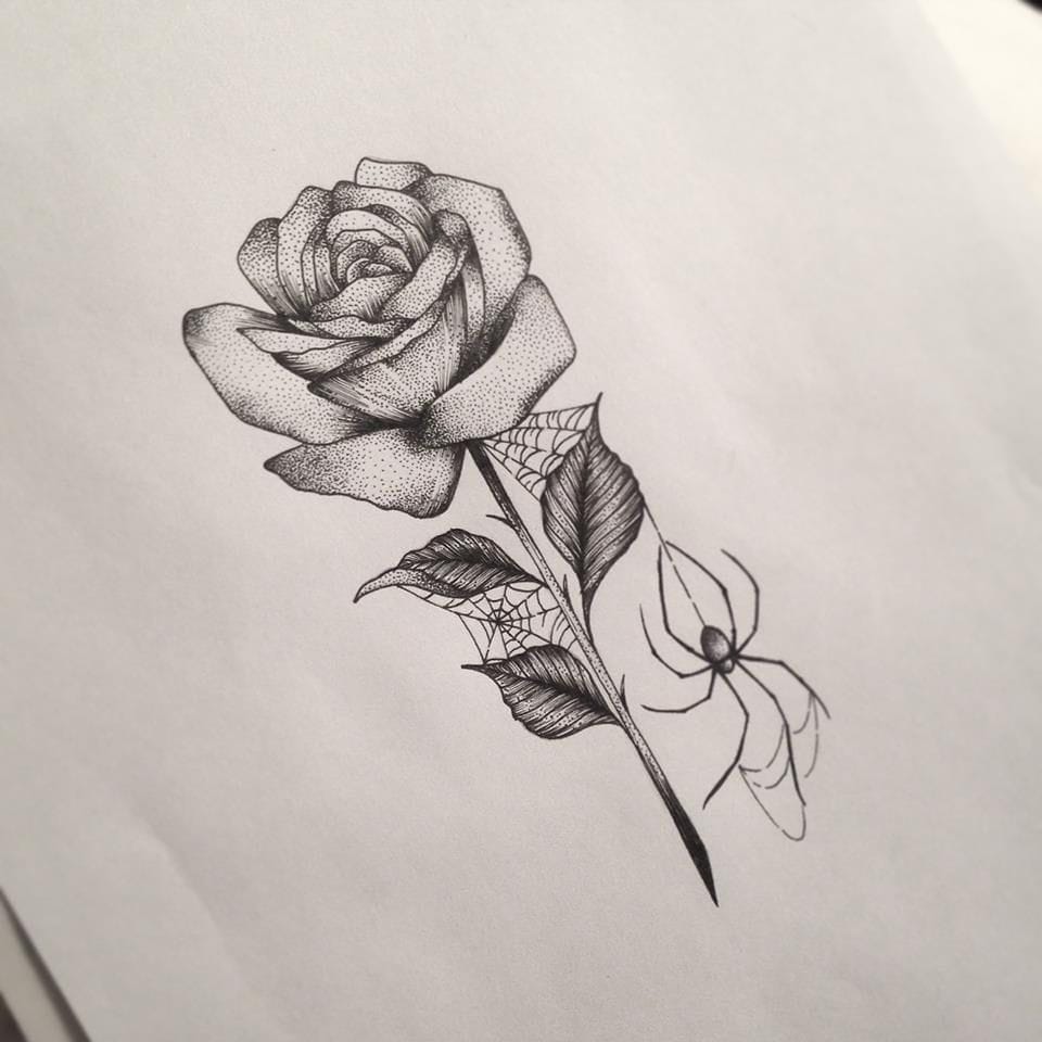 rose and spider web tattoo