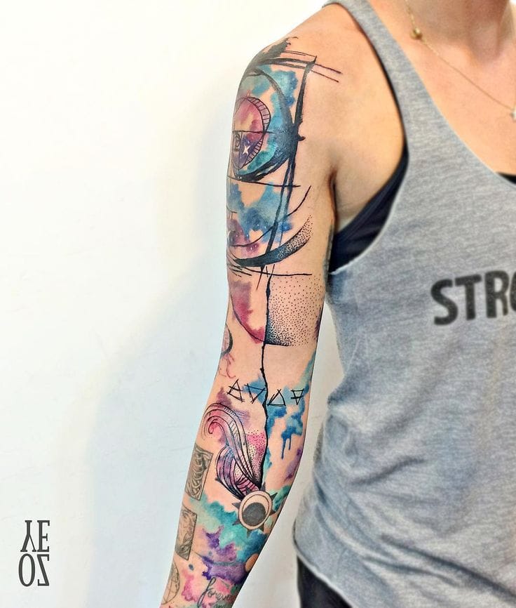 a muscular upper arm tattoo with watercolor effect