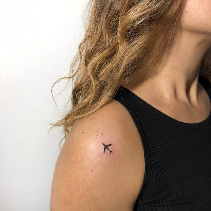 airplane on shoulder tattoo