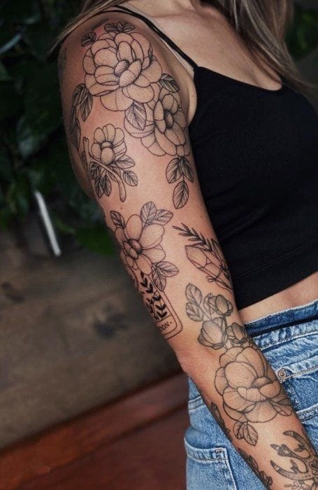 floral patchwork sleeve tattoo
