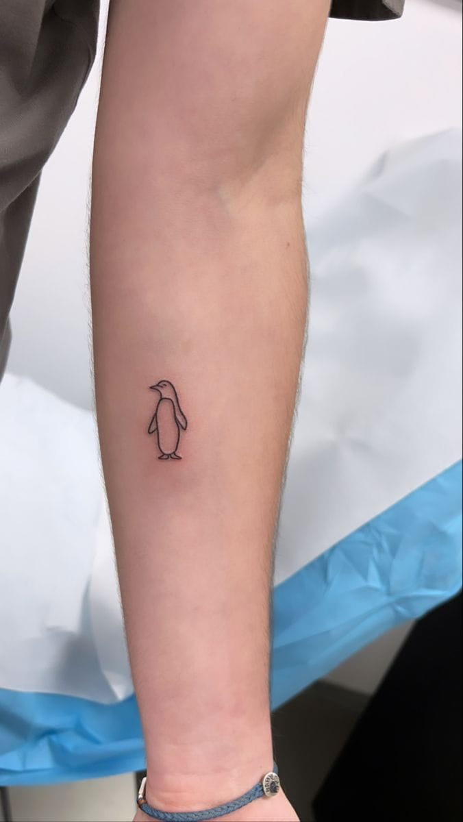 simple outline penguin tattoo