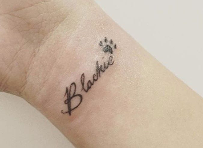 minimalist pet name tattoo
