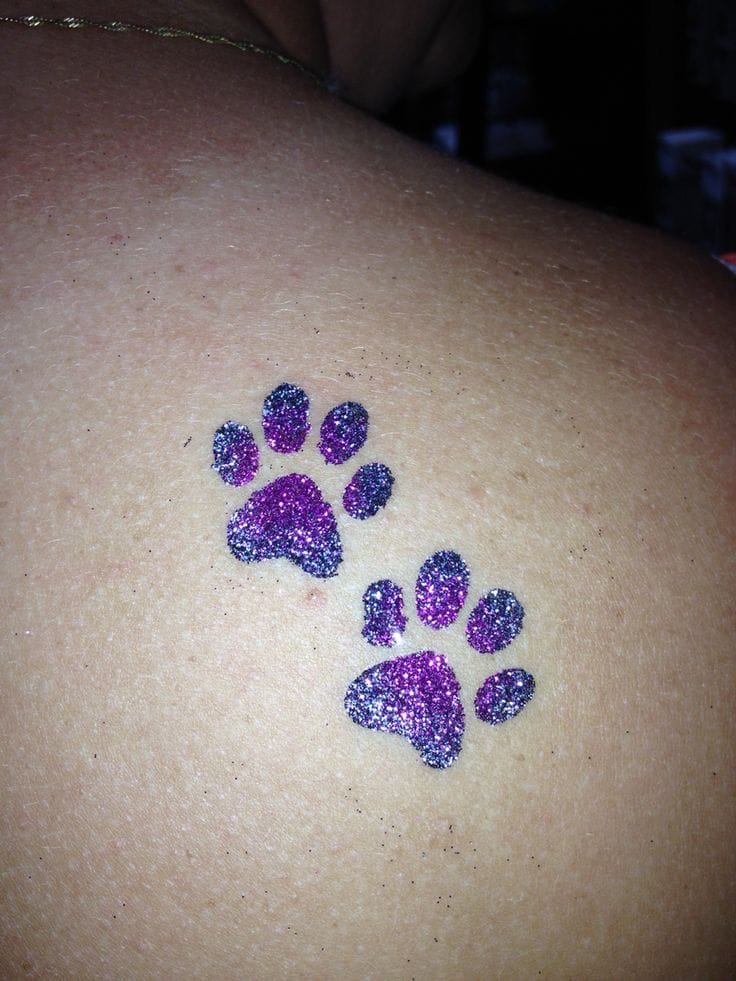 a dazzling glitter tattoo with glitter paw print