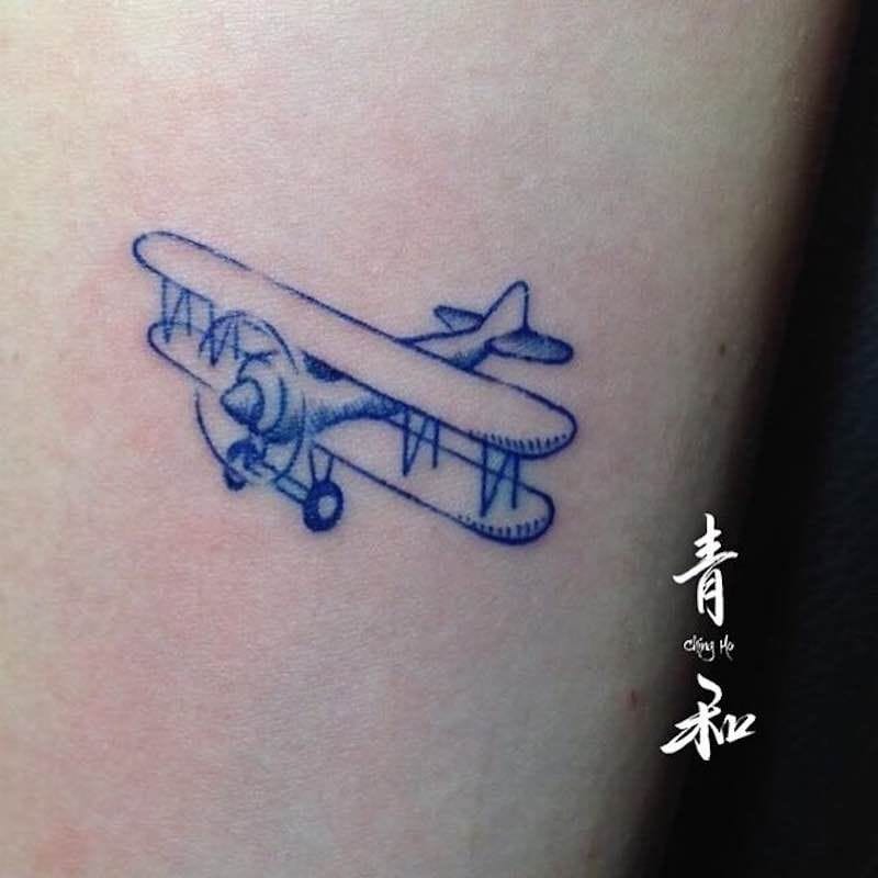 cartoon airplane tattoo