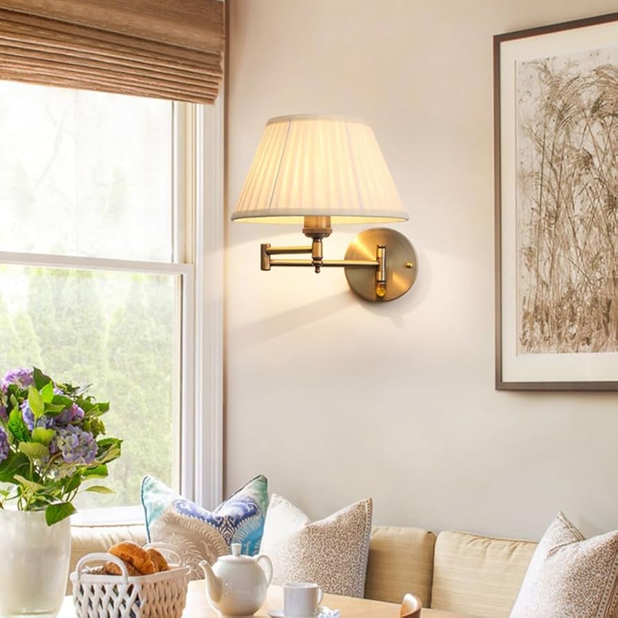 living room with vintage-inspired wall lamps with antique finish