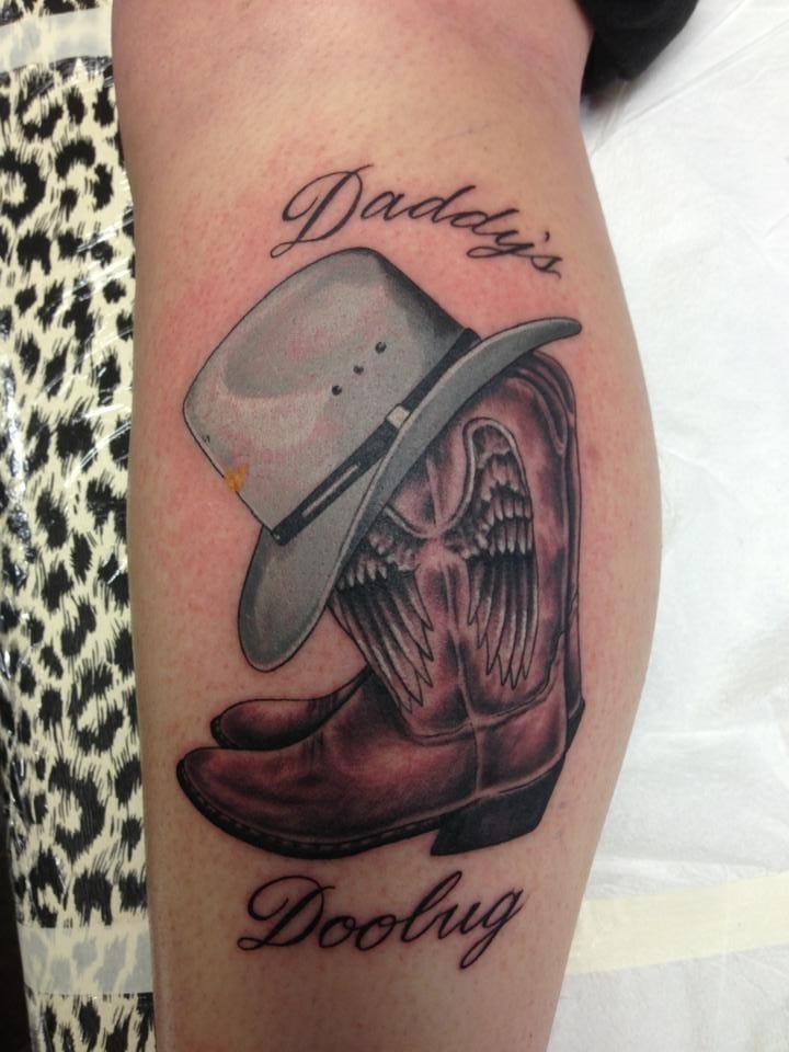 wild west with quote-embedded cowboy hat tattoos in script font