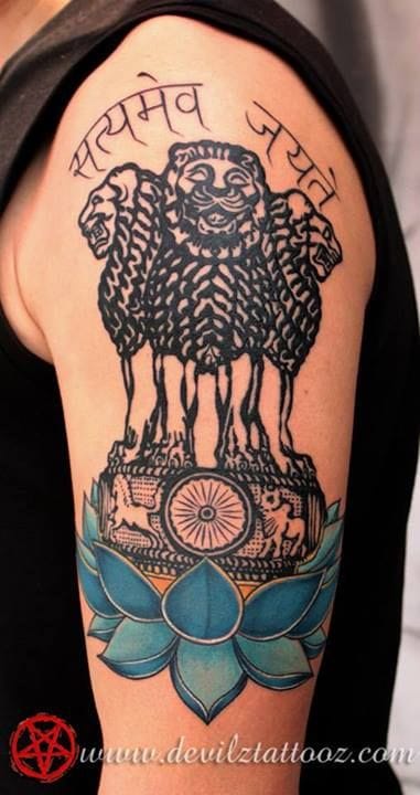 an Indian tattoo with a chakra symbol