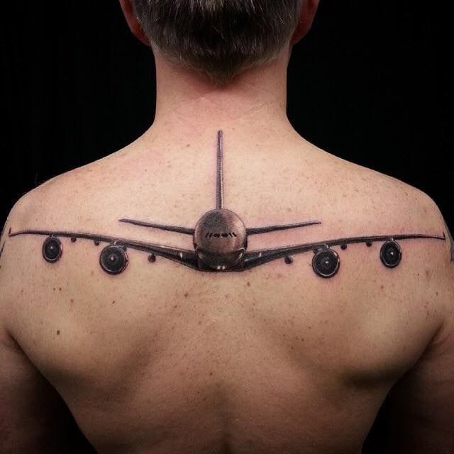 airplane on back tattoo