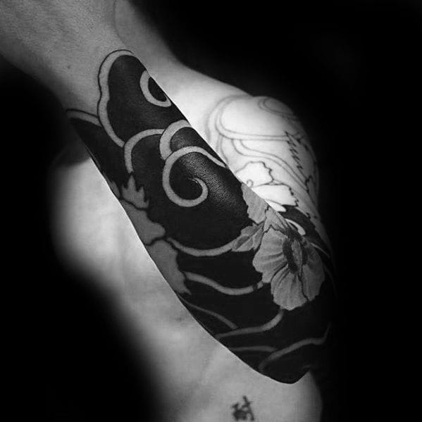 blackwork cloud sleeve tattoo