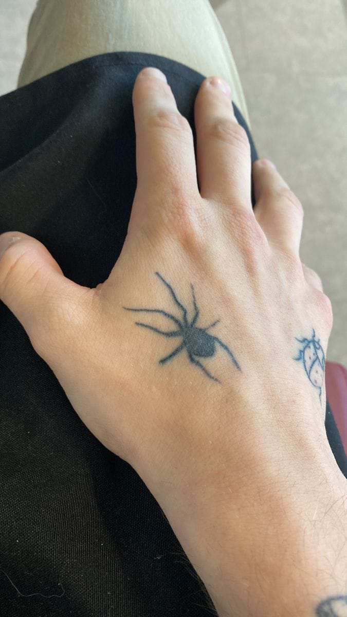 hand spider tattoo