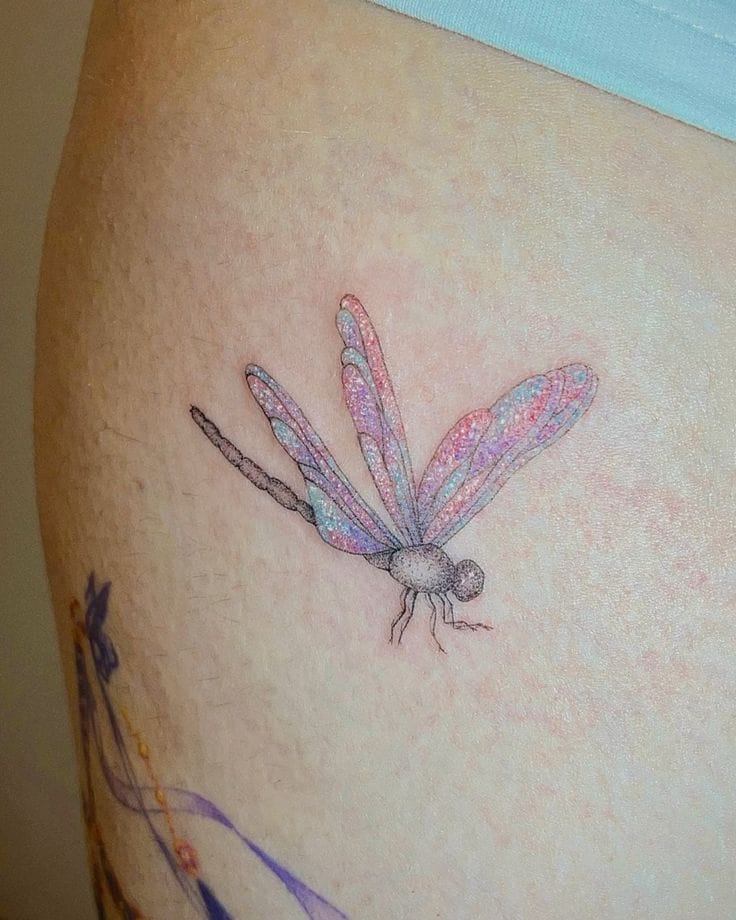 a dazzling glitter tattoo with sparkling dragonfly