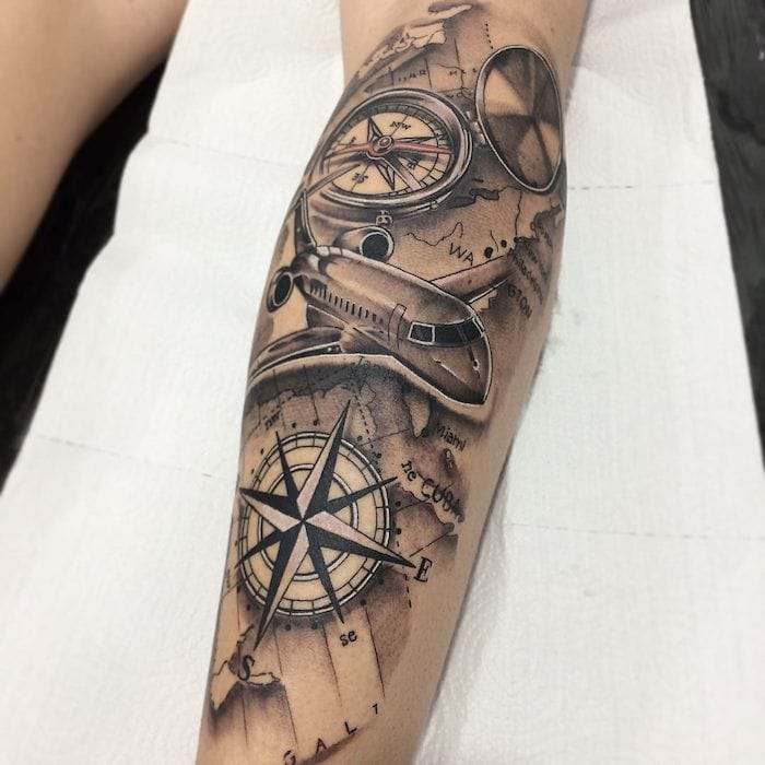 airplane with compass tattoo