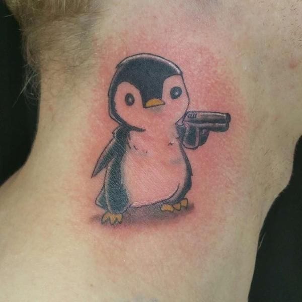 cartoon style penguin tattoo