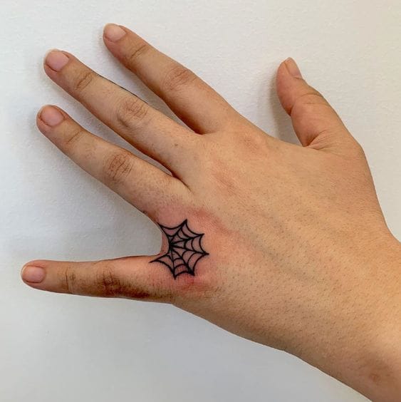 finger spider web tattoo