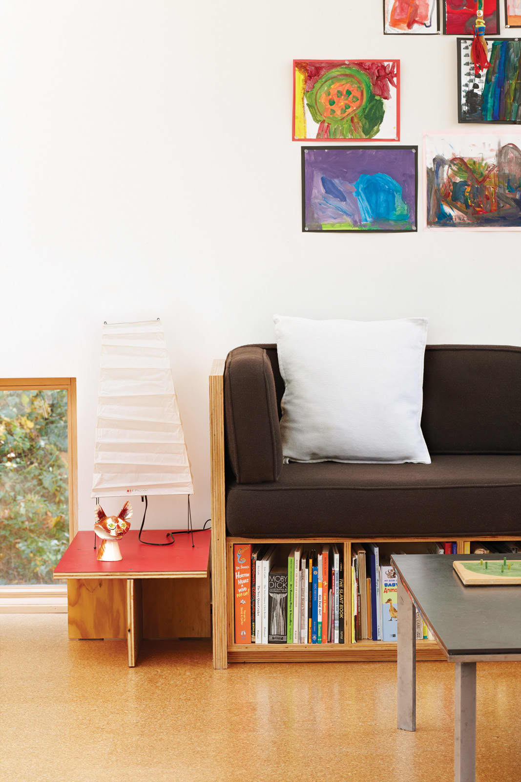 a small living room with under-sofa storage