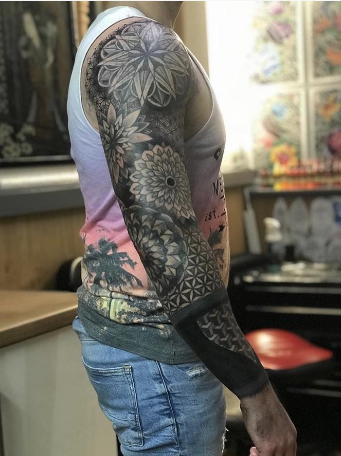 geometric mandala patchwork sleeve tattoo