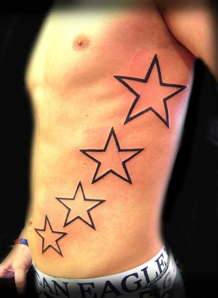 a cool ribs tattoo with nautical star