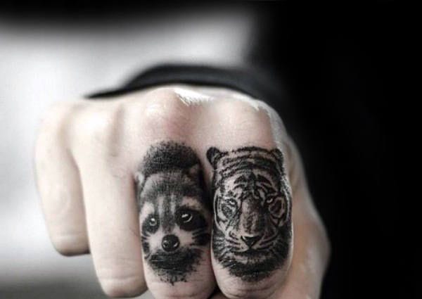 finger raccoon tattoo