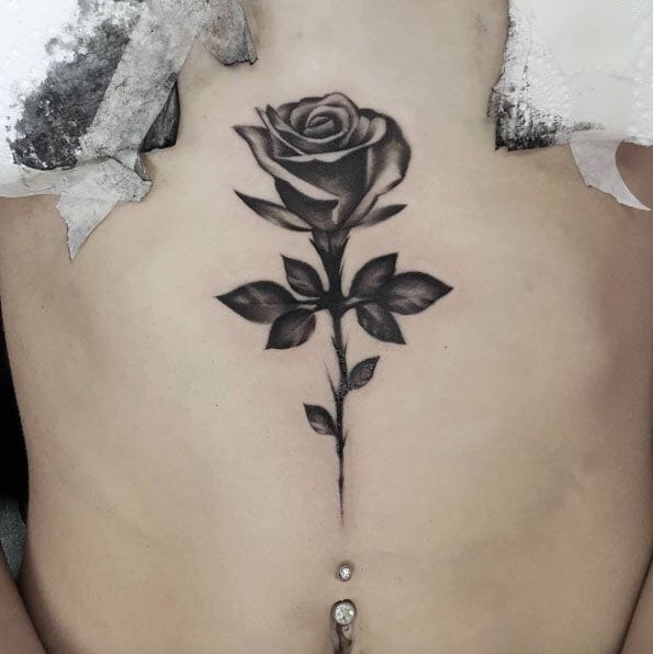 sternum placement rose tattoo