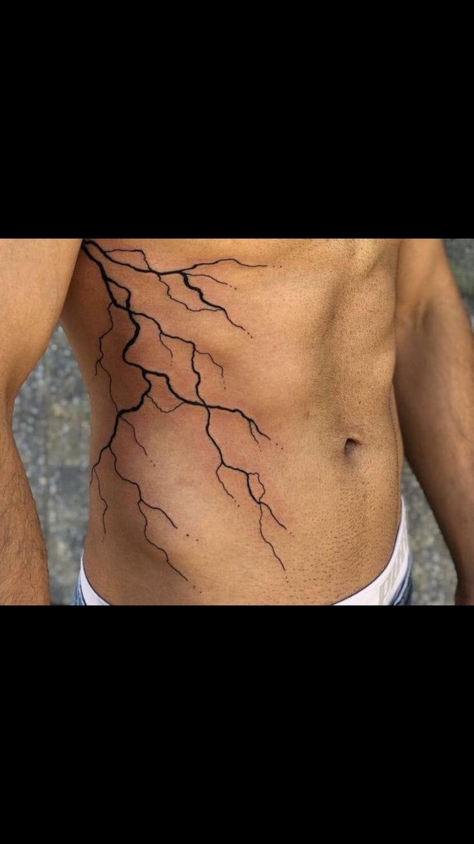 a cool ribs tattoo with lightning bolt and geometric shapes