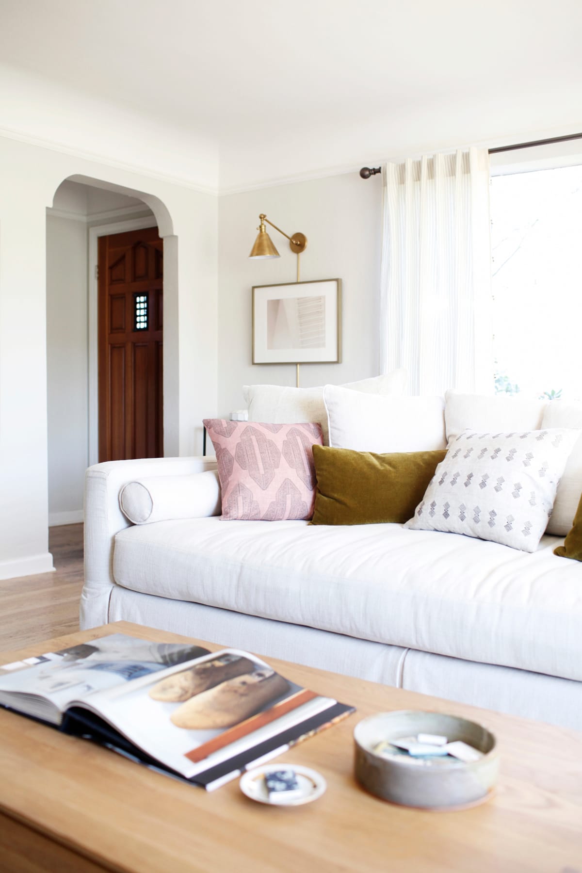 living room with plug-in wall lamps for easy installation