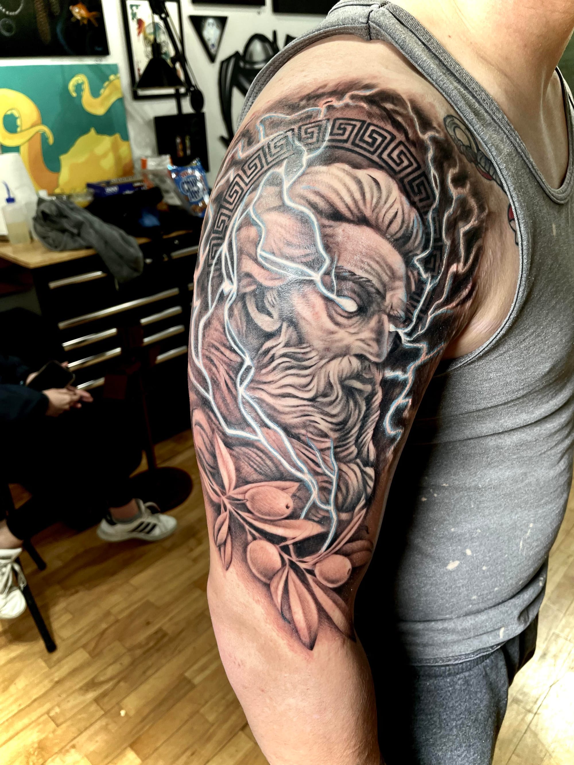 detailed zeus arm tattoo