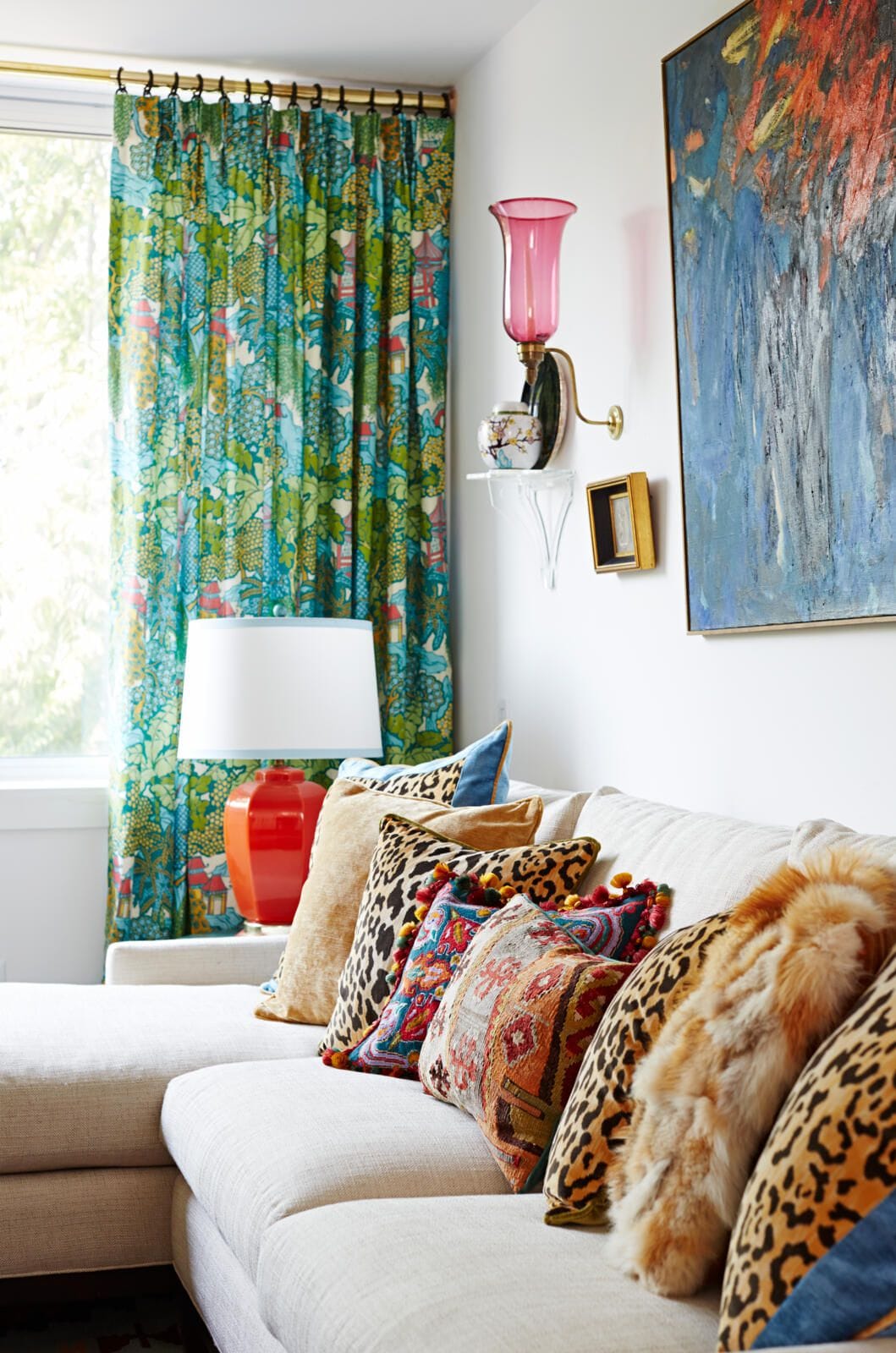 a living room with bold patterned curtains