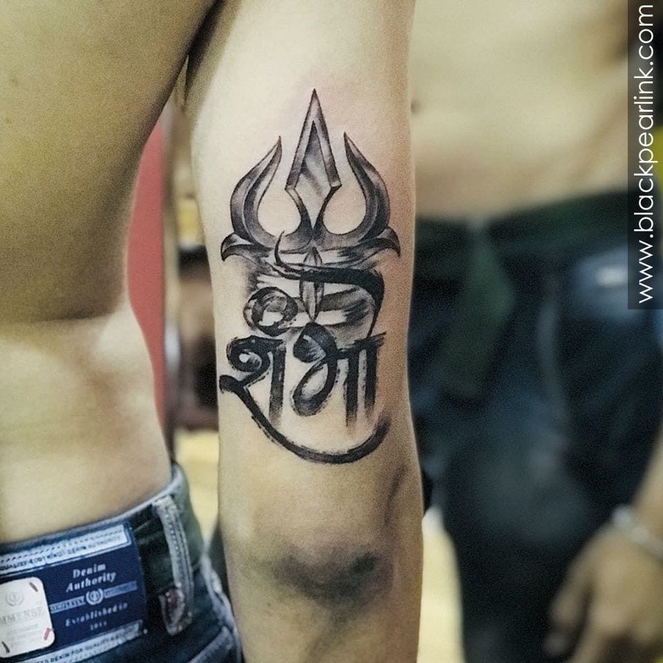 an Indian tattoo with a trishul design