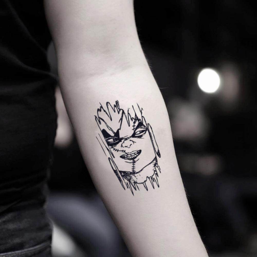 minimalist chucky tattoo