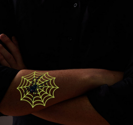 glow-in-the-dark spider tattoo