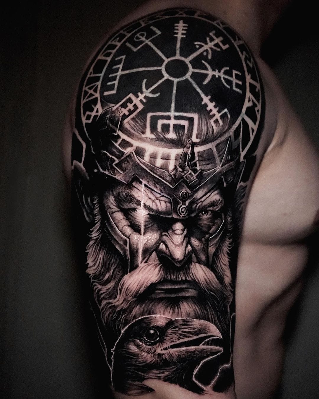 upper arm with norse mythology inspired rune tattoo