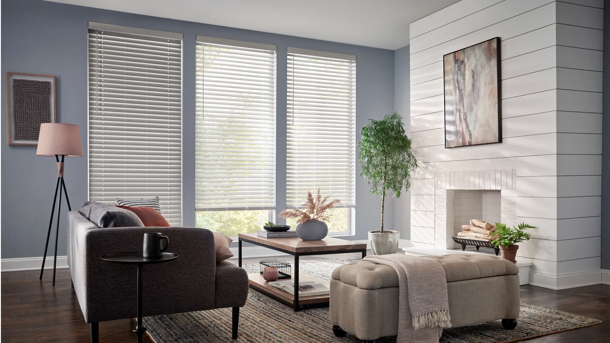 a stunning living room with faux wood blinds