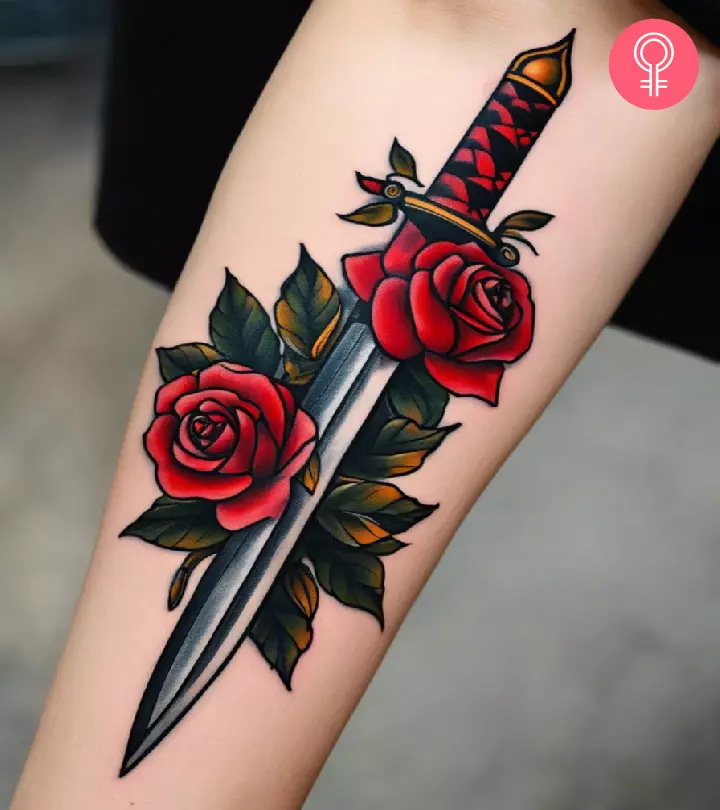 upper arm with dagger tattoo with roses in traditional style