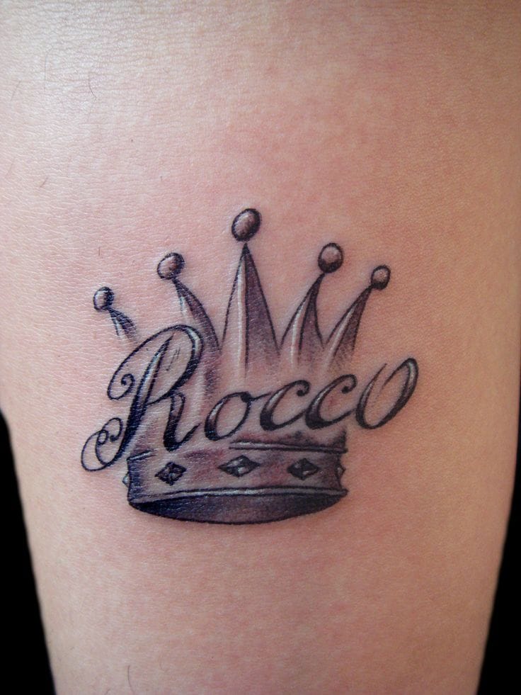 name inscribed crown tattoo