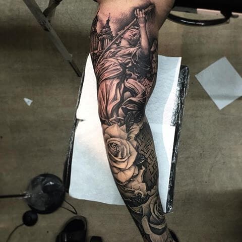 Flowing seamlessly from thigh to ankle, this breathtaking leg sleeve transforms skin into a canvas of divine artistry and natural beauty. The dramatic figure reaching skyward creates powerful vertical movement that draws the eye upward, while delicate roses ground the composition with organic softness. A masterpiece of contrast and storytelling that proves the most stunning tattoos blend spiritual symbolism with flawless technical execution 🖤