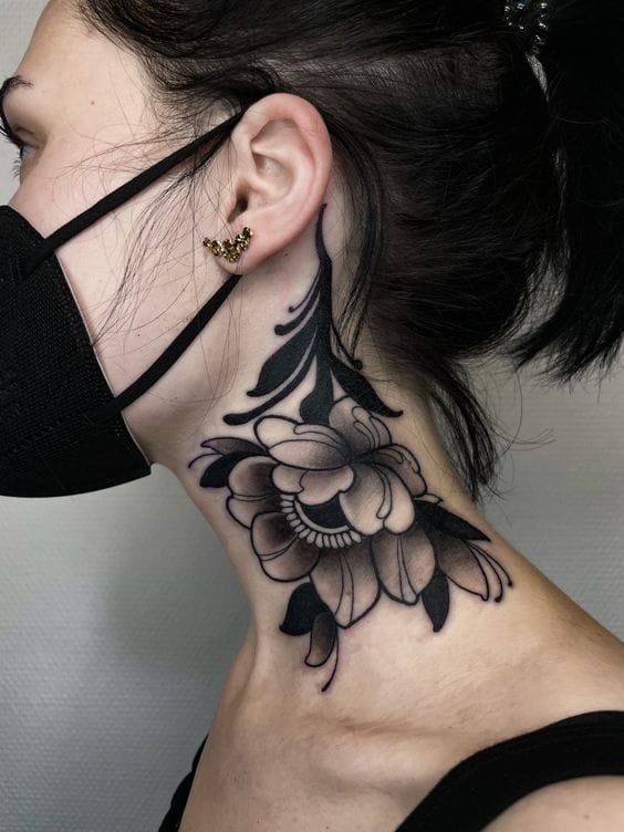 Delicate petals cascade down the neck in this stunning botanical masterpiece, where traditional floral motifs meet contemporary blackwork artistry. The strategic placement creates a mesmerizing flow from ear to shoulder, with intricate shading that brings dimensional depth to each bloom 🌸 Perfect inspiration for anyone considering a neck piece that's both feminine and boldly artistic.