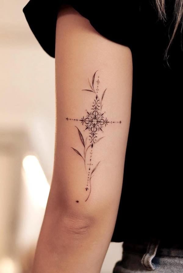 Delicate botanical elements dance around an intricate mandala centerpiece in this stunning forearm piece, creating a perfect harmony between geometric precision and organic flow. The fine line work and dotted details give it an almost ethereal quality, like a sacred garden blueprint etched in skin ✨ The vertical composition follows the natural curve of the arm beautifully, making this design both elegant and meaningful.