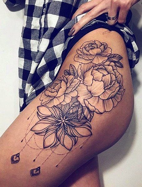 Cascading down the thigh like a botanical masterpiece, this stunning floral composition combines delicate peonies with geometric dotwork that creates perfect visual balance. The fine line artistry and strategic placement make this piece both sensual and sophisticated, while the dangling chain elements add an unexpected touch of modern elegance. 🌸