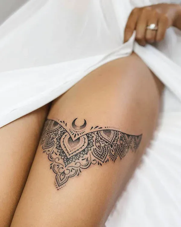 Delicate mandala patterns flow across this thigh placement like an intricate lace design, featuring geometric petals and mystical crescents that create stunning visual depth. The ornate detailing and strategic positioning make this piece both sensual and spiritually meaningful ✨