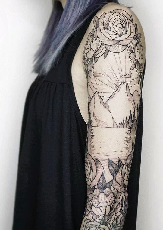 Delicate linework transforms this full sleeve into a botanical masterpiece, where roses and peonies cascade down the arm in perfect harmony. The artist's incredible attention to detail shines through every petal and leaf, creating depth and movement that makes the flowers appear to dance across the skin 🌹 Notice how the subtle shading and negative space work together to give this black and grey piece such stunning dimension.
