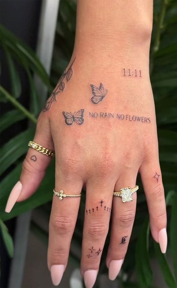 Delicate butterflies dance across this hand in perfect harmony with the meaningful phrase