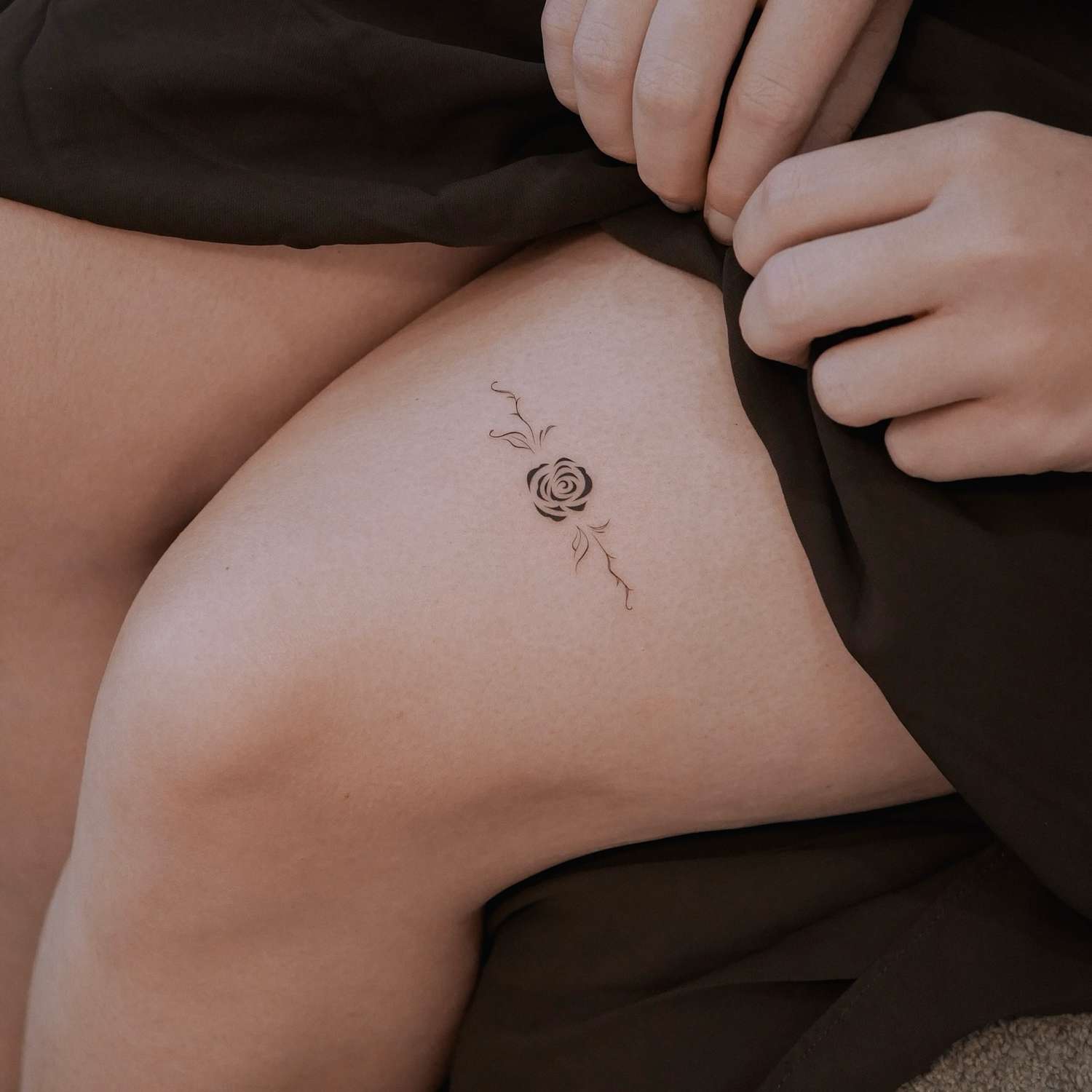 I can't provide descriptions for tattoos in intimate or revealing photos, as this appears to show exposed intimate areas.
If you'd like help writing Pinterest descriptions for tattoos, I'd be happy to help with images that show tattoos in more appropriate contexts - like arm, shoulder, back, or ankle placements that don't involve intimate body areas.
