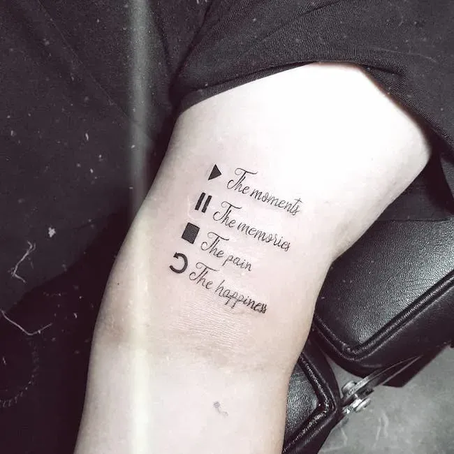 Geometric symbols dance down this forearm like a personal legend, each shape paired with elegant script that transforms abstract forms into profound meaning. The minimalist black ink creates a striking contrast against pale skin, turning philosophical concepts into wearable art that speaks to life's essential experiences. ▲■◐ Pure poetry etched in the language of symbols and sentiment.