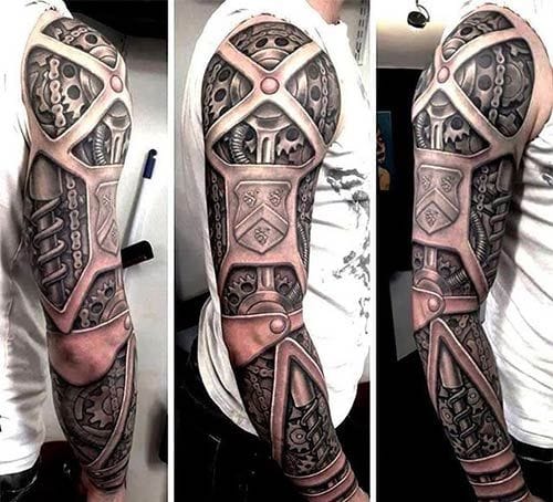 Biomechanical artistry reaches new heights in this full sleeve masterpiece that transforms the arm into a window of mechanical wonder. The intricate shading and dimensional depth create an illusion of actual metal plates and gears beneath the skin, while skulls peer through the